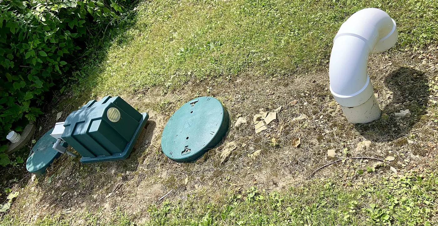 Septic tank access lids in a lawn